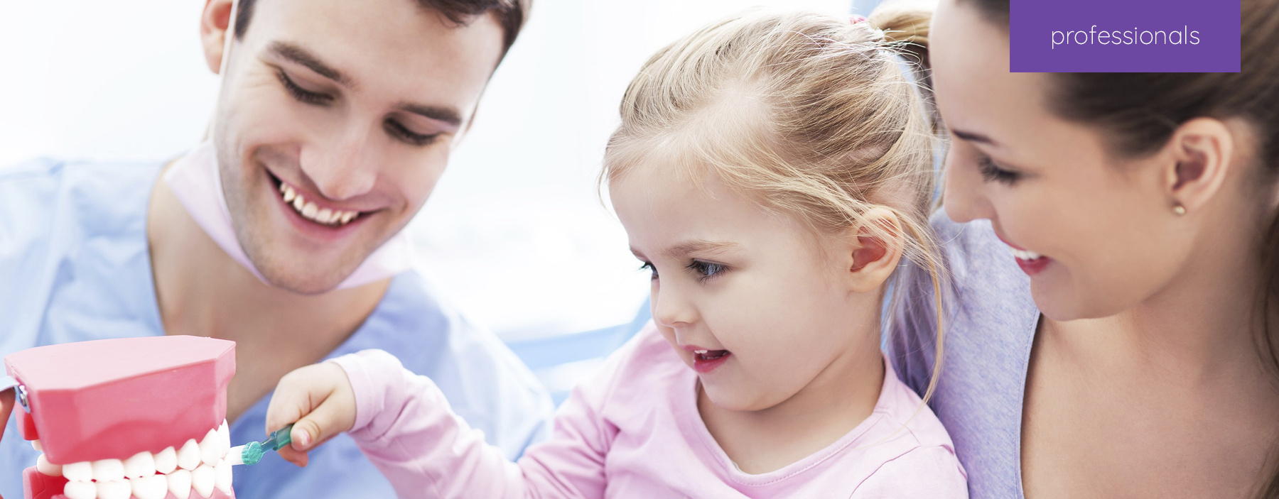 A child patient interacting with her mother and dentist