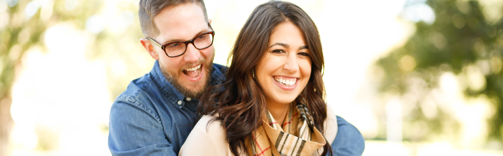 A man and a woman smiling